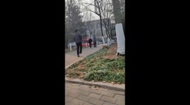 Playful pup leads student on a chase for slipper at university in China