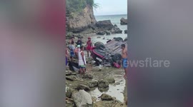 Russian woman killed and two injured when car falls off 200ft coastal cliff in the Philippines