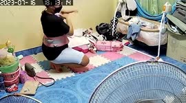 Mum slips on mat while holding her baby