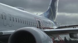 Aviation investigators check Alaska Airlines jet that had fuselage ripped open mid-air