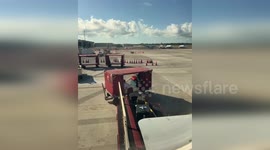 American Airlines pilot earns praise online for helping load bags onto plane