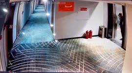 Drunk hotel guest fail! Man stumbles, falls after erratically kicking fire extinguisher