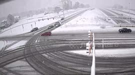 Car skidding off icy road takes out traffic lights in Kansas