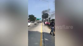 Drivers flee as motorcycle bursts into flame on roadside
