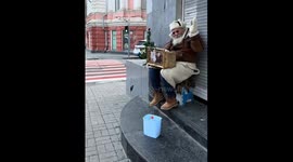 Kharkiv's melodic grandpa rings in the new year with streetside cheer