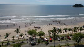 Life guards resuscitating drowning victim. With helicopter transport. On the beach in Brazil
