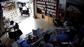 Out-of-control motorbike speeds into phone store in China