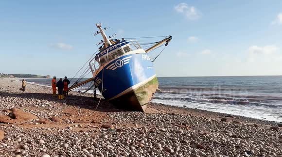 Cornish fishing boat stranded on Budleigh Salterton beach, Devon, UK