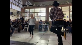 An elderly pageant dances at the popular Club Obregon cantina in Hermosillo Mexico. They dance to regional Mexican music