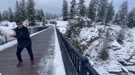 Throwing Snow Onto Icy River