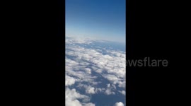 Japan's. H2A rocket launch seen ascending from passing airplane