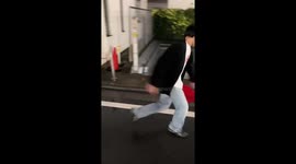 Friend takes a tumble attempting to kick plastic in rainy Guangxi