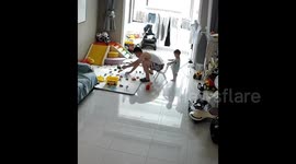 Naughty toddler moves a chair making dad fall in Shandong, China.
