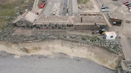 Final stages of demolition job of former hotel threatened by cliff erosion on UK coast