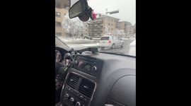 Cleaning Snow Off Stranger's Back Window