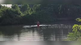 Buddhist monk rescues drowning dog from river