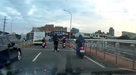 Scooter Man Slips In Traffic