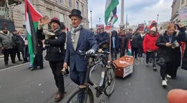 Pro-Palestine protester wheels coffin in London as grim death toll in Gaza reaches 23,000