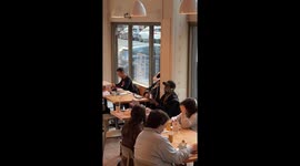 Man Casually Performs Magic at Portland Cafe
