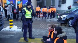 Climate activists glue themselves to road in protest against WEF meeting in Davos, Switzerland