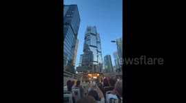 City skyscrapers and neon-lit streets in Hong Kong, China