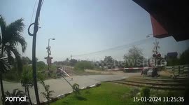 Bungling motorcycle rider clotheslined by level crossing barrier in Thailand