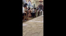 Adorable moment toddler drives down wedding aisle in toy car