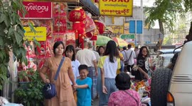 Chinatown in Yangon bustling with people buying Spring Festival decorations