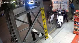 Chinese scooter rider narrowly avoids collision as truck slides dangerously close