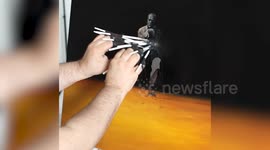 Painter creates art using ten brushes at once