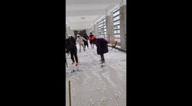 Students negotiate ice-covered floor at university in China