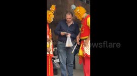 Monkey King impersonators spark outrage for alleged extortion of fees from photo-taking pedestrians in China
