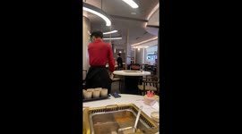 Waiters at this restaurant demonstrate precision and panache with long-range tea-pouring