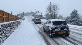 Pedestrians and motorists take it slow as snow covers streets in Cumbria