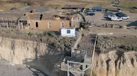 Version 2 Demolition of cliff top former hotel and National Trust cafe at National Trust's most popular site, birling Gap, East Sussex, UK