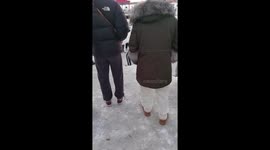 Locals look like penguins with small steps as they walk over icy floor
