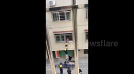 Brave bystanders save boy dangling from first-floor window in China