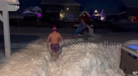 Buffalo Bills fans dance in snowy street after NFL play-off victory