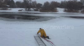 Heroic scene as firefighter rescues dog from frozen lake in Utah