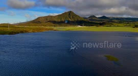 Kite surfer performing after Belal Cyclone in Reunion island on an ephemeral lake