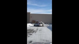Skid Loader Plows Into Police Cruiser