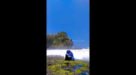 Waves of laughter: spontaneous joy amidst the turbulence at Pantai Madasari Beach