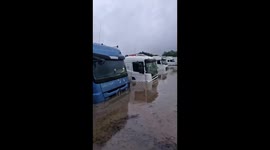 Severe flooding submerges trucks at Rio de Janeiro service Station