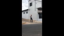 Bird Swoops Over Man's Head