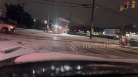 Vehicles Struggle to Stop at Icy Intersection