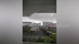 Strong winds tear roof from apartment building in Malaysia