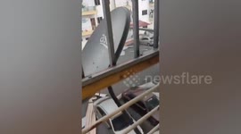 Strong winds blow away the roof of an apartment in Malaysia