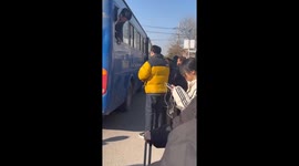 Passenger jumps queue by boarding bus through the window