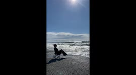 Big Waves Turn Relaxing Scene into Near Wet Experience