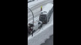 Truck used to push struggling bus up snowy hill in Canada